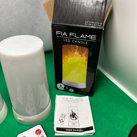 FIA Flame Candles. Set of 2, have 2 remotes and 1 box. Charging cables included. - Picture 6 of 6